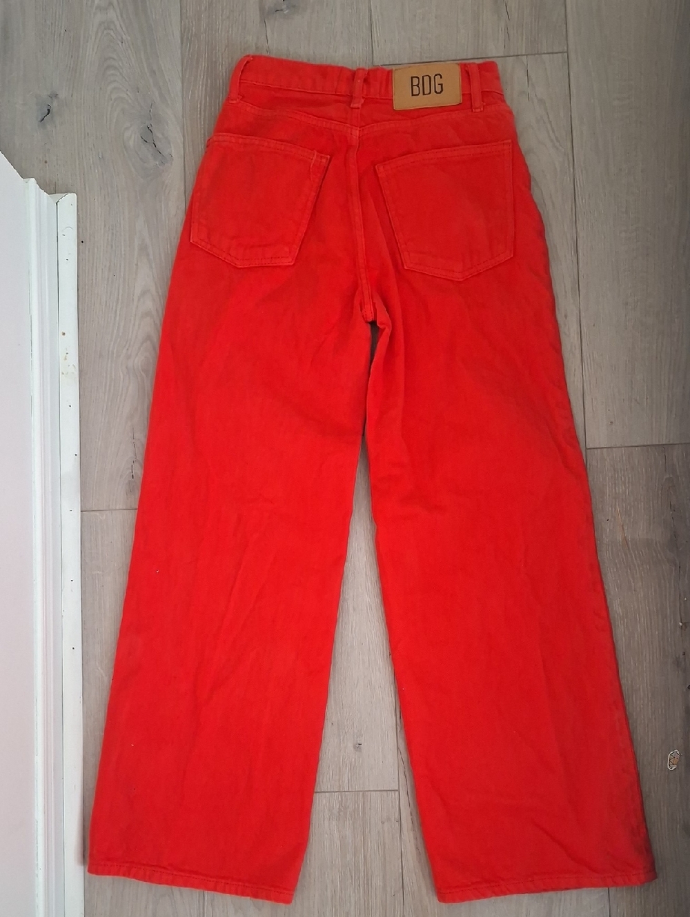 BDG Bright Orange/Red Denim Jeans with Tan Leather Patch